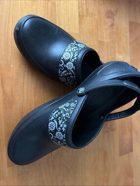 CROCS Black Slip-On Clogs with Floral Band size 10